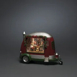 Caravan met kerstman die speelgoed repareert